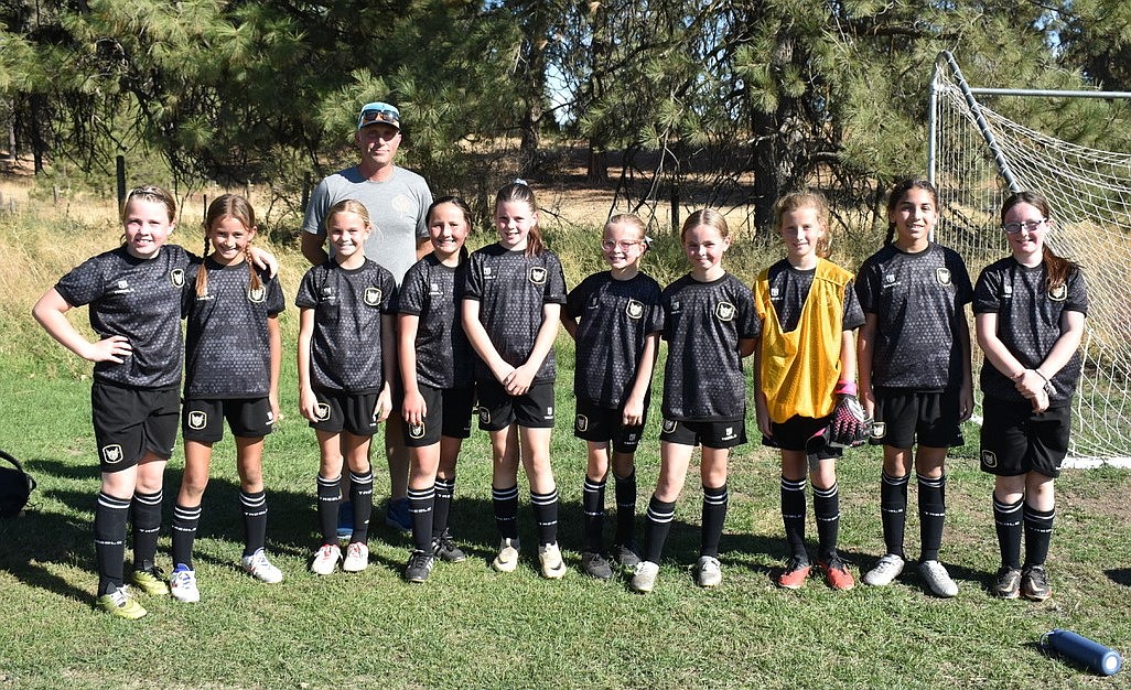 Courtesy photo
The Sting 2014 girls Black soccer team beat the Shadow N.Shale 3-1 last weekend in Spokane, with goals scored by Aida Stanley and Elise Hewitt-Nord. From left are Maddie Herndon, Audrey Rietze, Aida Stanley, Poppy Moreau, Elsie Hewitt-Nord, Rylan Parks, Quinn Baily, Emma Thompson, Sophia Moreno and Lyla Maestas; and rear, coach Ken Thompson.