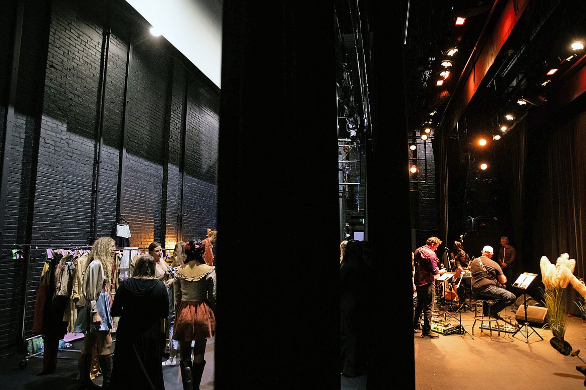 On the back stage at the Whitefish Performing Arts Center, sustainable clothing is fitted for a runway walk. On stage, Wild wind prepares to play music. (Photo provided by Hope Kaufman/hkcameraface) .