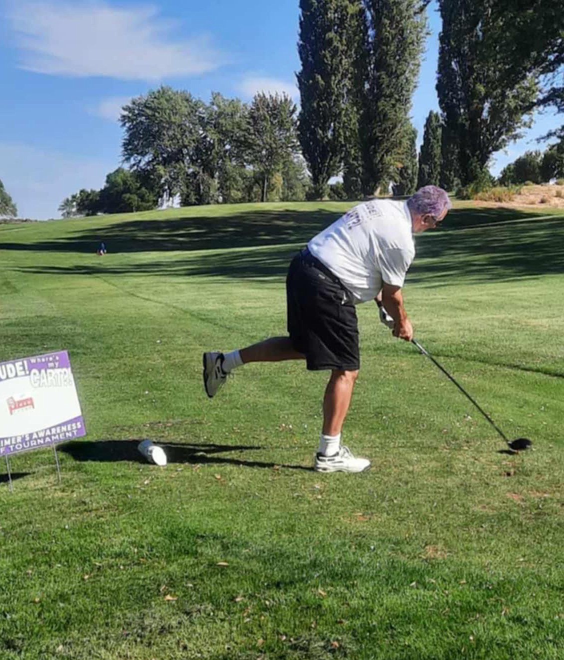 A golfer finds that his swing isn’t as good when he’s standing on one leg, just one of the challenges players faced in the Dude, Where’s My Cart?! golf tournament Saturday.