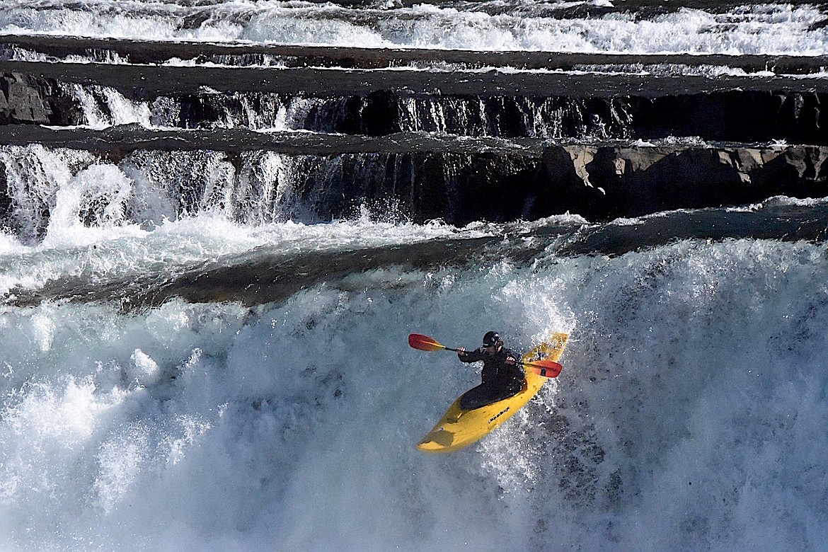 A kayaker goes over a waterfall on the Kootenai River Saturday, Sept. 21, 2024. (Scott Shindledecker/The Western News)