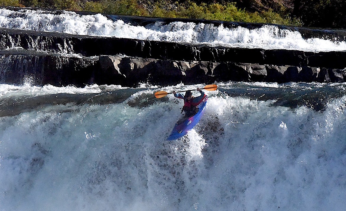 A kayaker goes over a waterfall on the Kootenai River Saturday, Sept. 21, 2024. (Scott Shindledecker/The Western News)