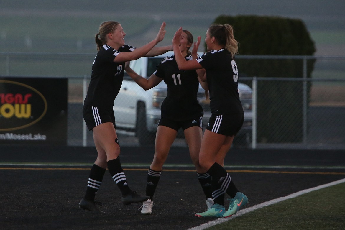 Royal players celebrate after senior Audrey Bergeson, left, scored a goal in the 35th minute of Tuesday’s match against College Place.