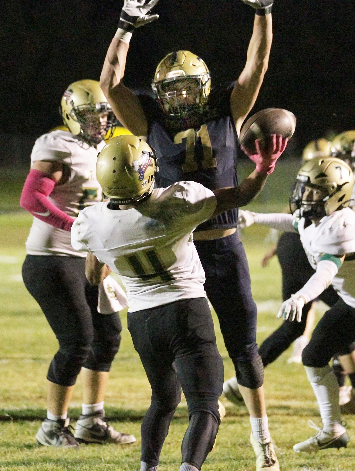 MARK NELKE/Press
Timberlake senior defensive lineman Jeremy Hurlbert attempts to deflect the pass of St. Maries wide receiver Julian Ceja-Grimaldo during last Friday's game at Van Tuinstra Memorial Stadium.