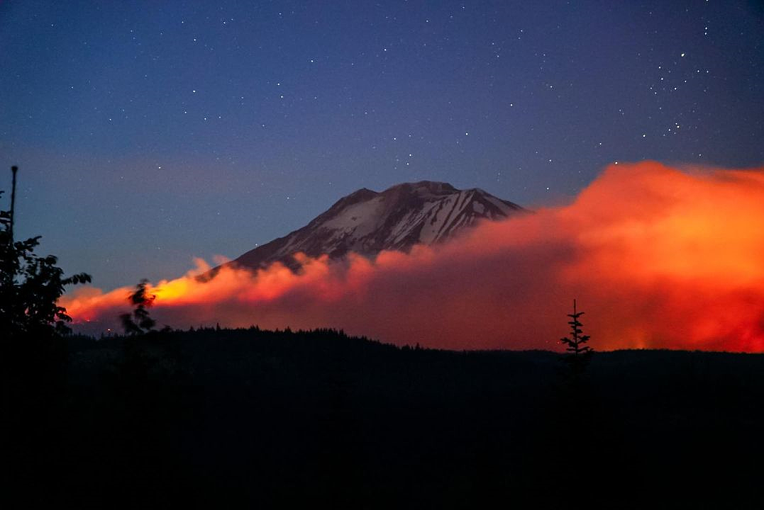 Smoke from the Williams Mine Fire hides portions of Mount Adams Aug. 11. The fire singed around 13,100 acres of land and was the fifth largest blaze in Washington in 2024. The fire began Aug. 5 from lighting and is expected to be contained by Oct. 31. However, Department of Natural Resources Wildfire Communications Manager, Ryan Rodruck said the wildfire is no longer active.