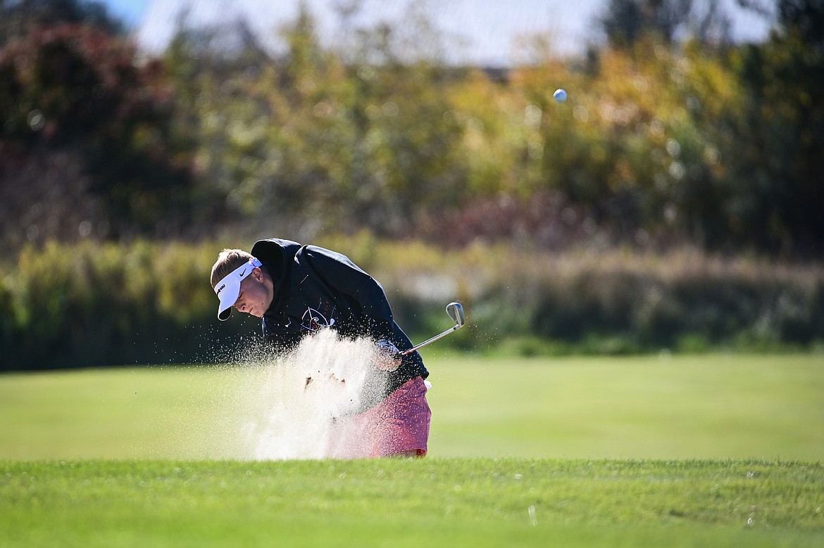 Bozeman's Cooper Bourret blasts out of a bunker on the fourteenth hole during the Class AA State Golf Tournament at Northern Pines Golf Club in Kalispell on Thursday, Oct. 3. (Casey Kreider/Daily Inter Lake)