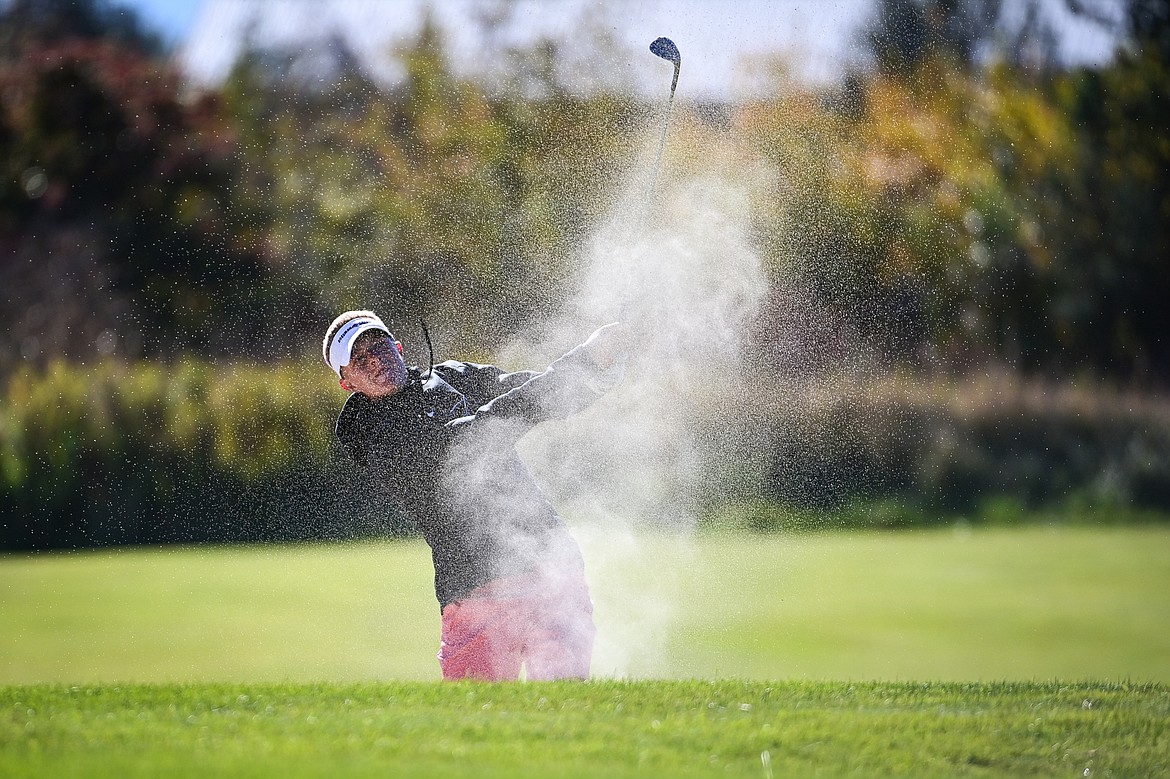 Bozeman's Cooper Bourret blasts out of a bunker on the fourteenth hole during the Class AA State Golf Tournament at Northern Pines Golf Club in Kalispell on Thursday, Oct. 3. (Casey Kreider/Daily Inter Lake)