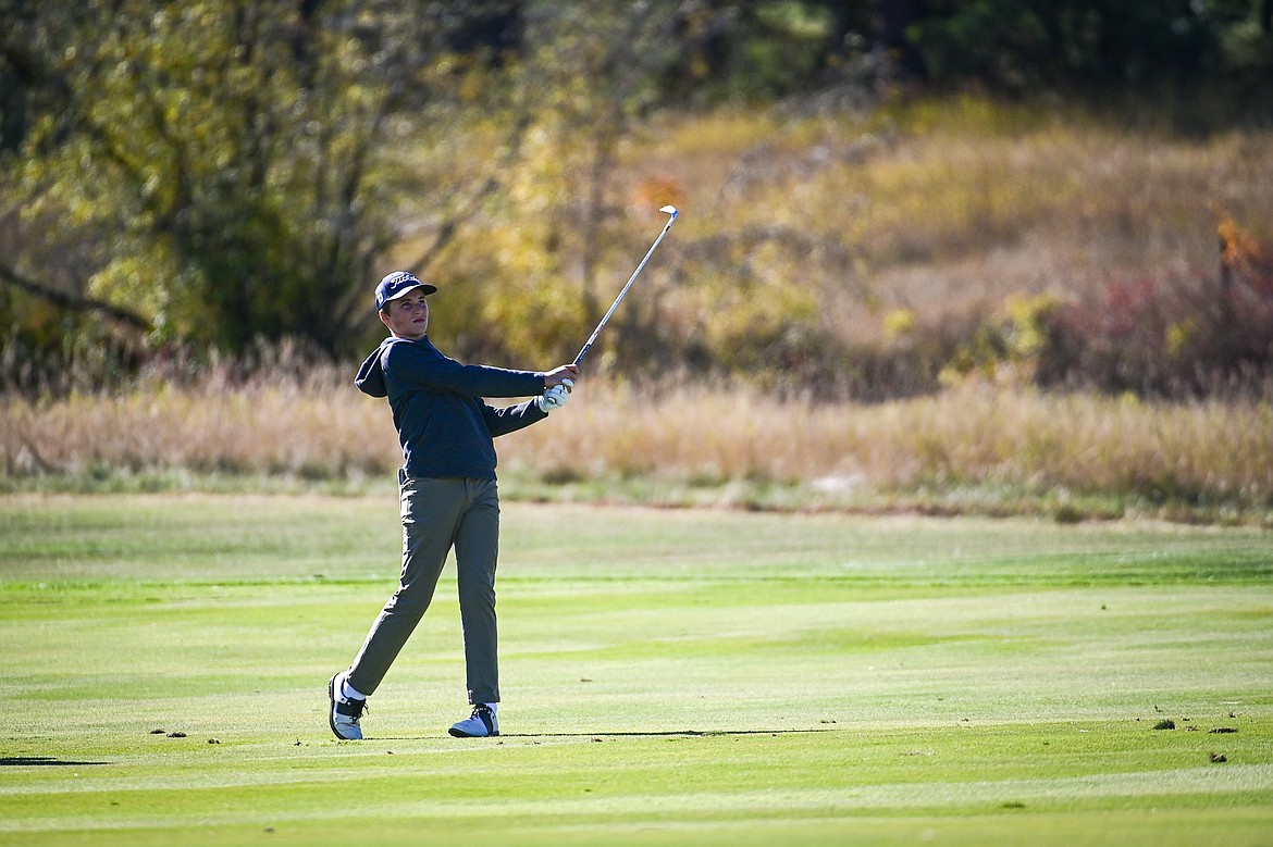 Great Falls CMR's Jack Pinsky hits his approach on the fourteenth hole during the Class AA State Golf Tournament at Northern Pines Golf Club in Kalispell on Thursday, Oct. 3. (Casey Kreider/Daily Inter Lake)