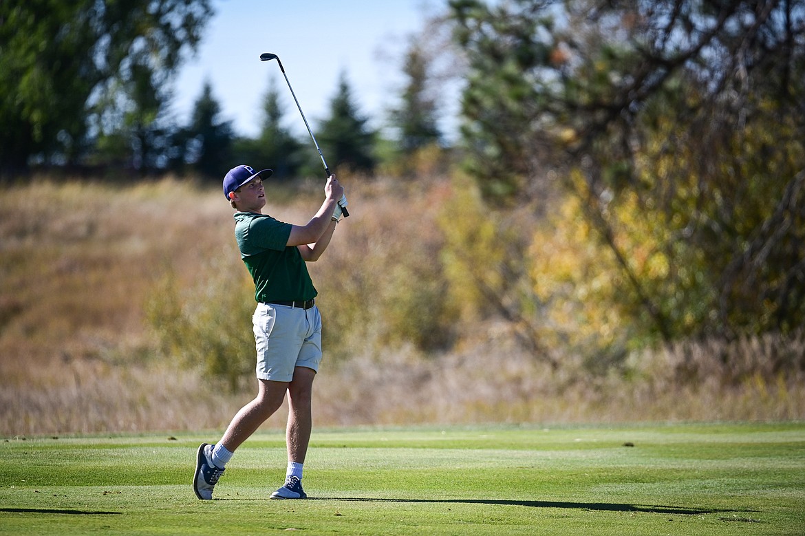 Glacier's Torren Murray hits his approach on the fourteenth hole during the Class AA State Golf Tournament at Northern Pines Golf Club in Kalispell on Thursday, Oct. 3. (Casey Kreider/Daily Inter Lake)