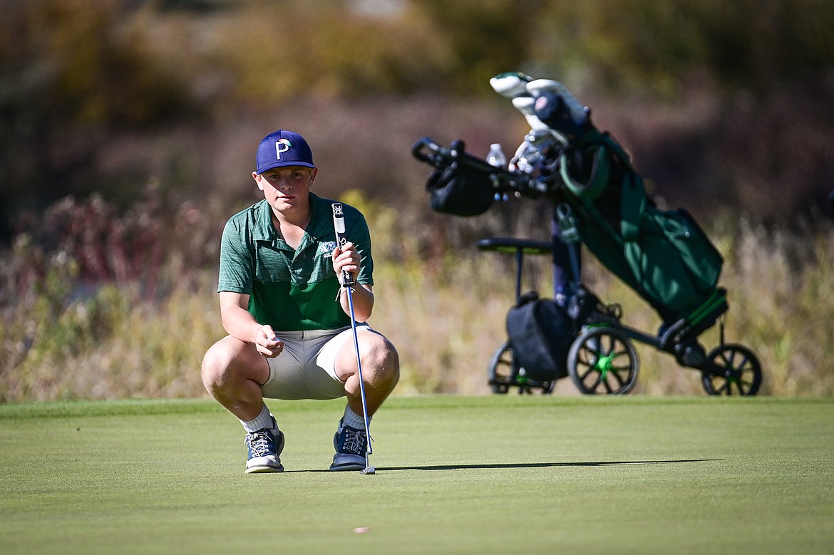 Glacier's Torren Murray lines up a putt on the fourteenth green during the Class AA State Golf Tournament at Northern Pines Golf Club in Kalispell on Thursday, Oct. 3. (Casey Kreider/Daily Inter Lake)