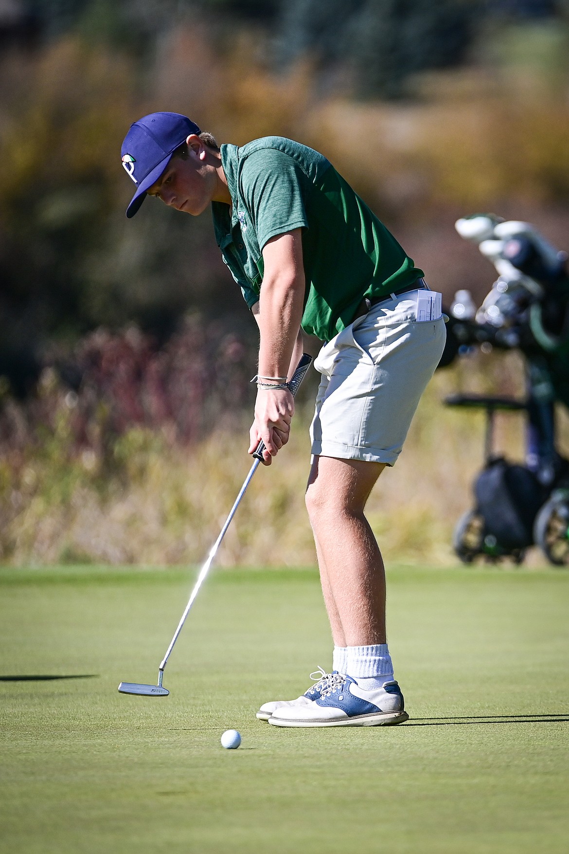 Glacier's Torren Murray putts on the fourteenth green during the Class AA State Golf Tournament at Northern Pines Golf Club in Kalispell on Thursday, Oct. 3. (Casey Kreider/Daily Inter Lake)