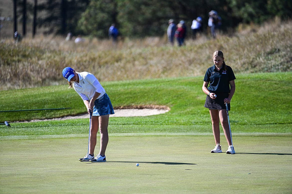 Gallatin's Kiah Holmes-Morrissey putts on the ninth green during the Class AA State Golf Tournament at Northern Pines Golf Club in Kalispell on Thursday, Oct. 3. (Casey Kreider/Daily Inter Lake)