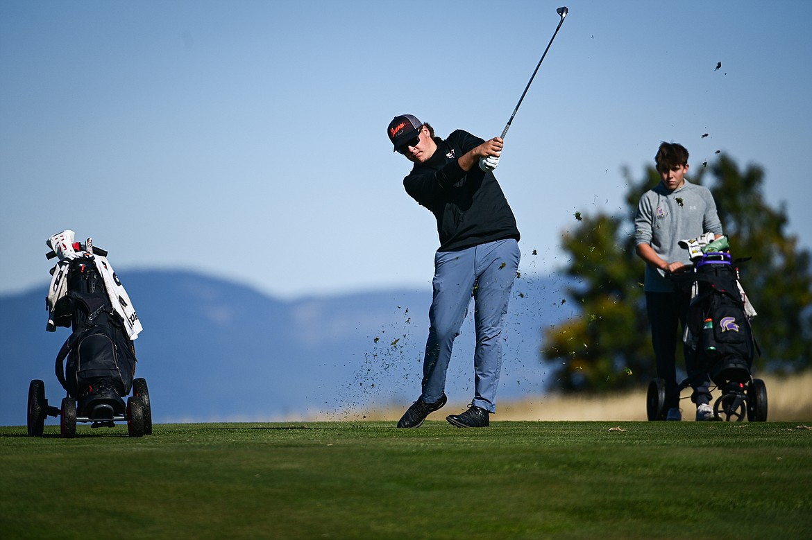 Flathead's Dylan Morris hits his approach on the eleventh hole during the Class AA State Golf Tournament at Northern Pines Golf Club in Kalispell on Thursday, Oct. 3. (Casey Kreider/Daily Inter Lake)