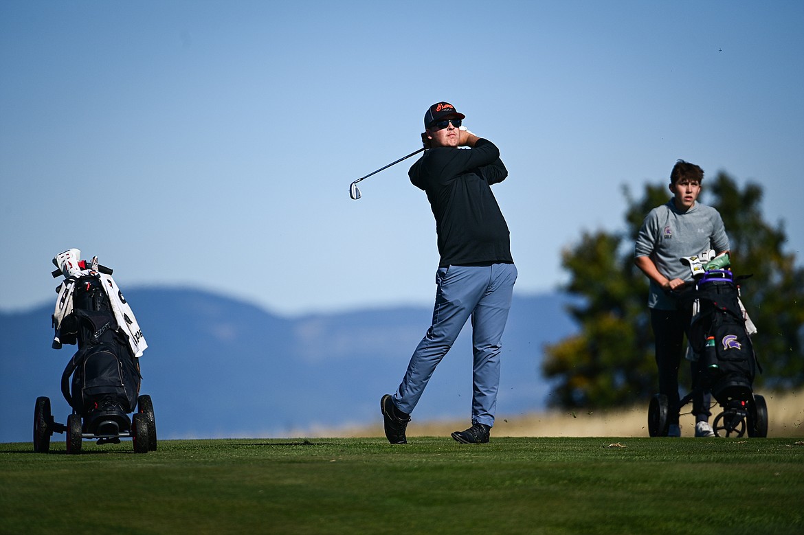 Flathead's Dylan Morris hits his approach on the eleventh hole during the Class AA State Golf Tournament at Northern Pines Golf Club in Kalispell on Thursday, Oct. 3. (Casey Kreider/Daily Inter Lake)