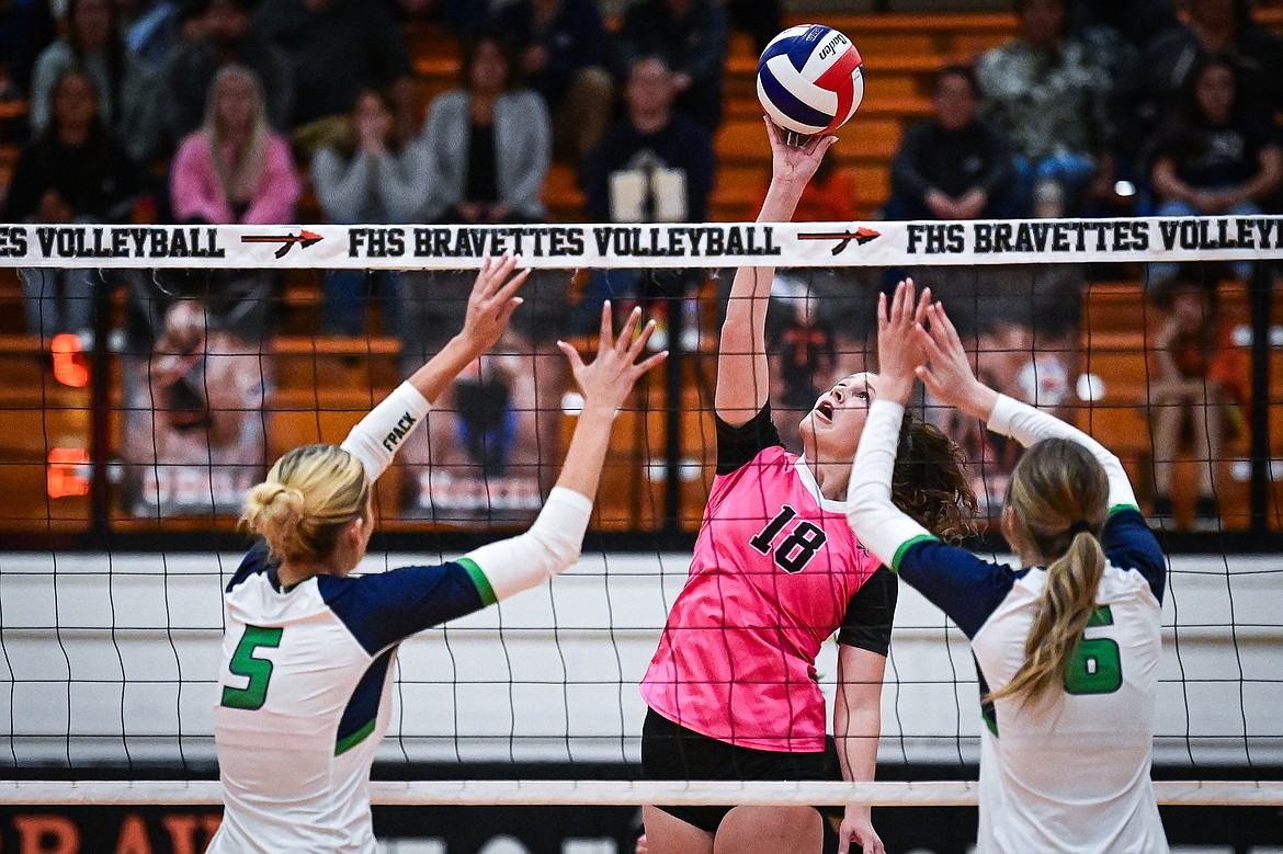 Flathead's Emma Eve (18) goes to the net for a kill against Glacier at Flathead High School on Thursday, Oct. 3. (Casey Kreider/Daily Inter Lake)