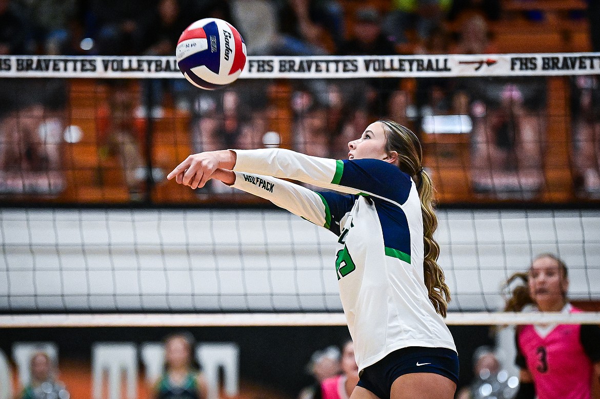 Glacier's Grace Lingle (13) bumps the ball over the net against Flathead at Flathead High School on Thursday, Oct. 3. (Casey Kreider/Daily Inter Lake)