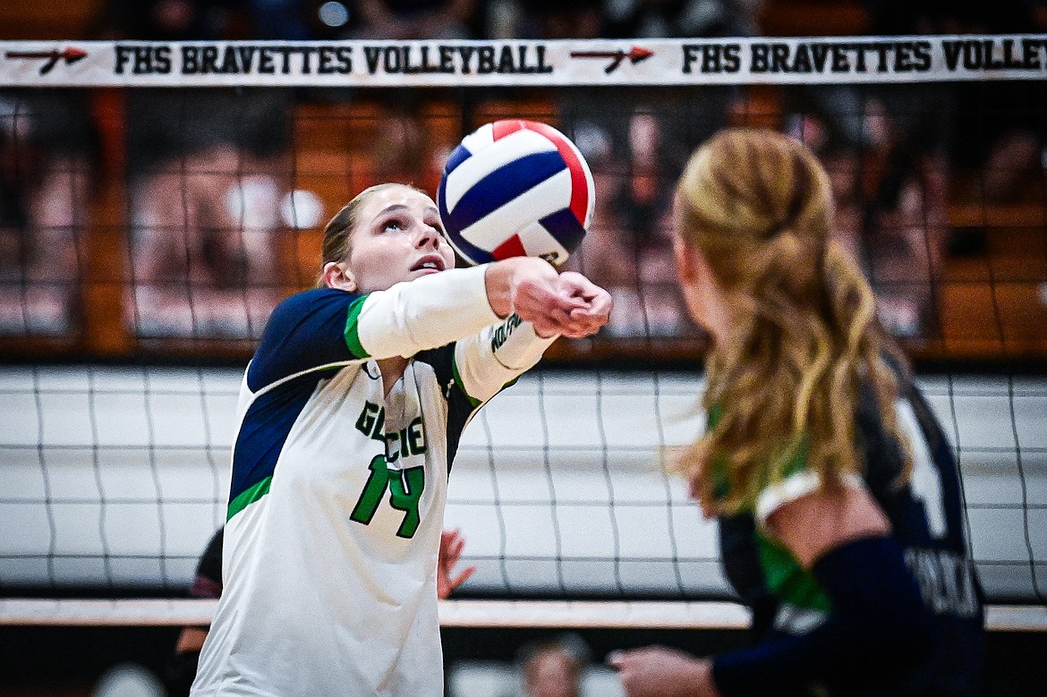 Glacier's Stella Bayard (14) passes to a teammate at the net against Flathead at Flathead High School on Thursday, Oct. 3. (Casey Kreider/Daily Inter Lake)