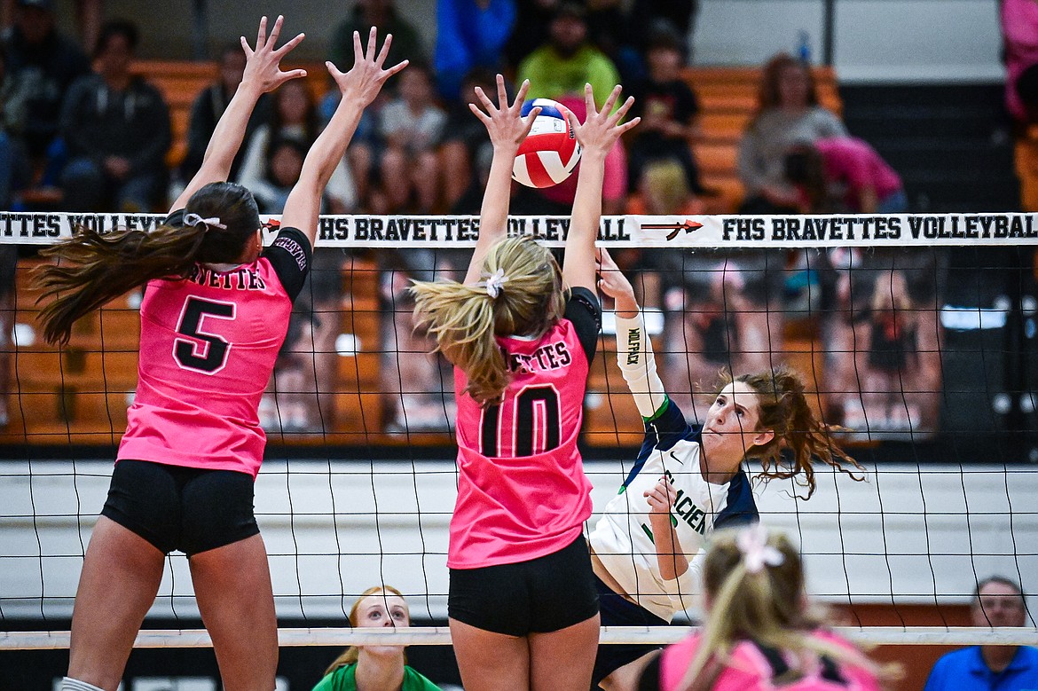 Glacier's Cassidy Daniels (3) goes to the net for a kill against Flathead at Flathead High School on Thursday, Oct. 3. (Casey Kreider/Daily Inter Lake)