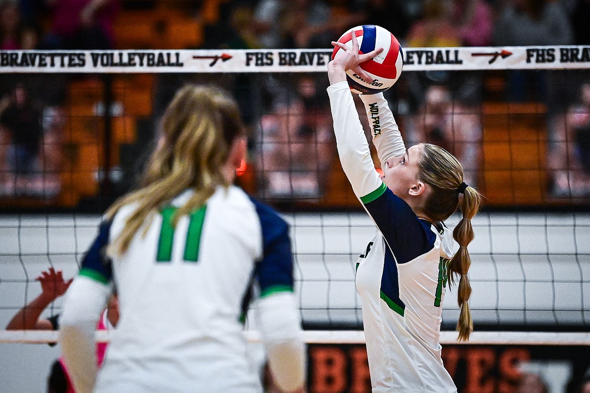 Glacier's Stella Bayard (14) passes to a teammate at the net against Flathead at Flathead High School on Thursday, Oct. 3. (Casey Kreider/Daily Inter Lake)