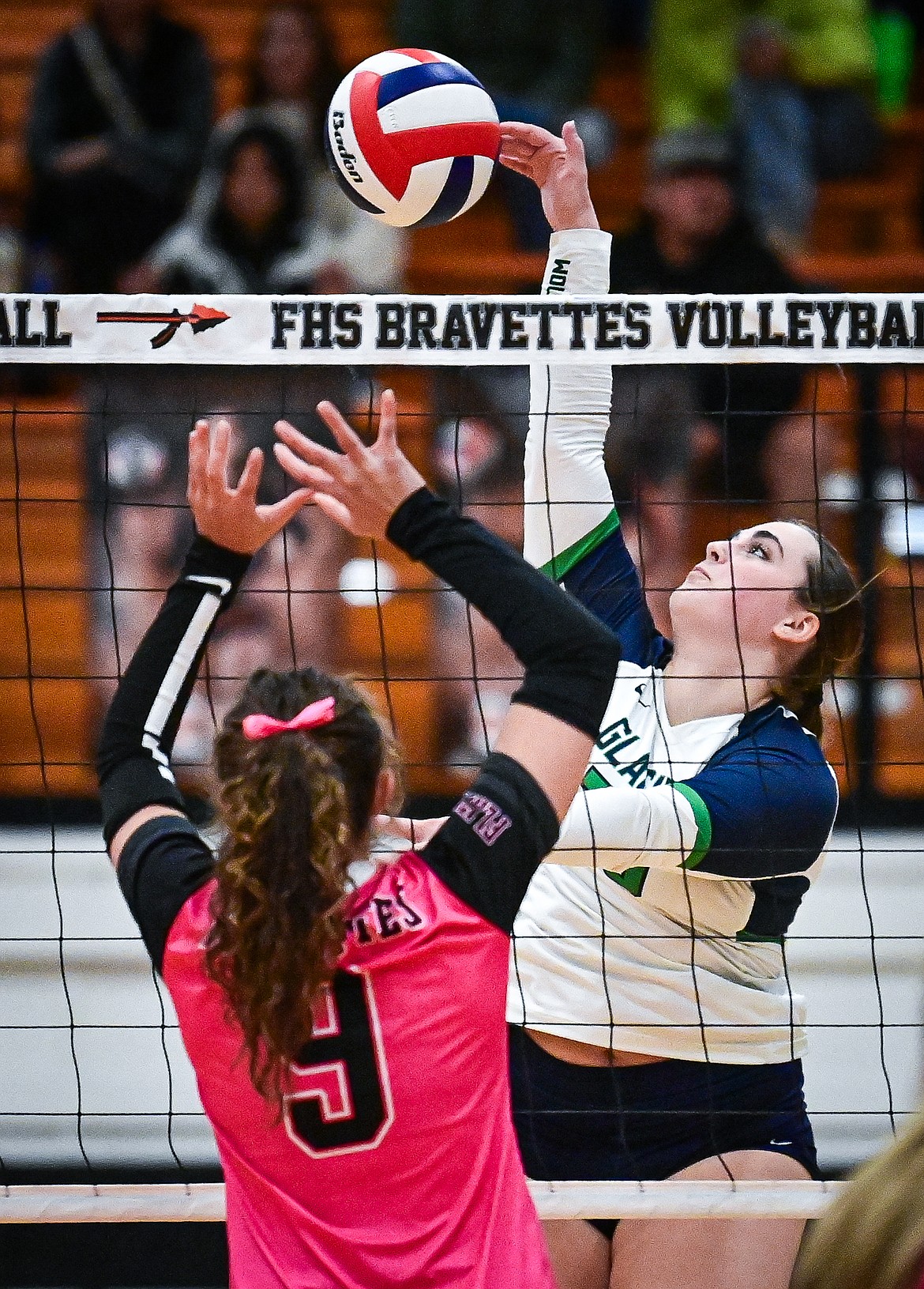 Glacier's Sydnie Ryan (20) goes to the net for a kill against Flathead at Flathead High School on Thursday, Oct. 3. (Casey Kreider/Daily Inter Lake)