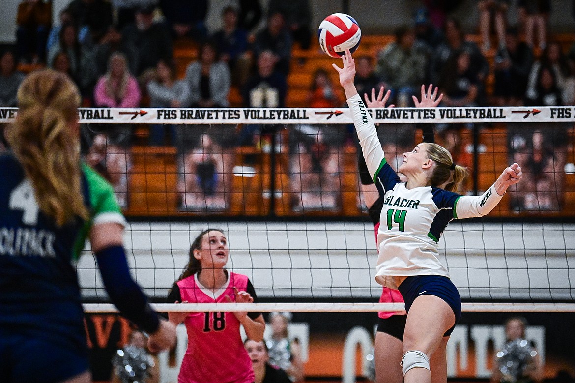 Glacier's Stella Bayard (14) plays a ball at the net against Flathead at Flathead High School on Thursday, Oct. 3. (Casey Kreider/Daily Inter Lake)