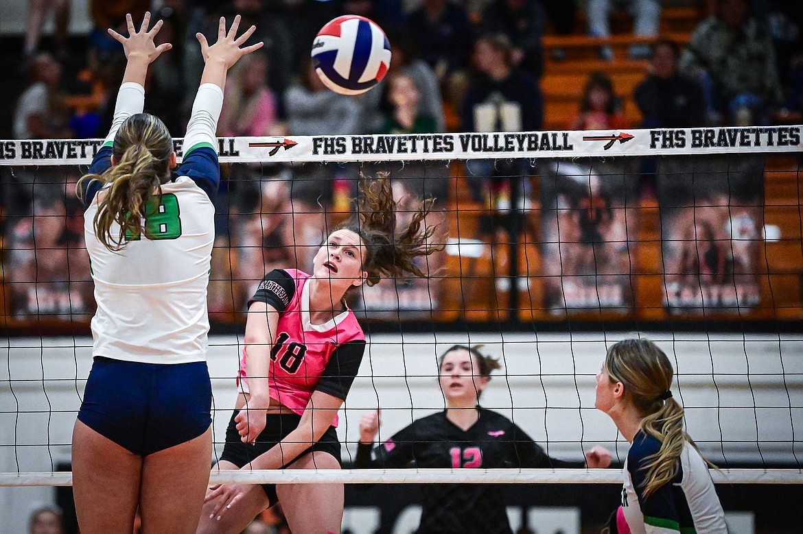 Flathead's Emma Eve (18) goes to the net for a kill against Glacier at Flathead High School on Thursday, Oct. 3. (Casey Kreider/Daily Inter Lake)