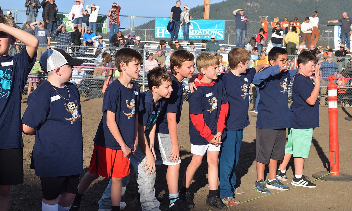 Fourth graders from the Northwest Expedition Academy lock in ahead of their race during the CDA School District Cross Country Meet.