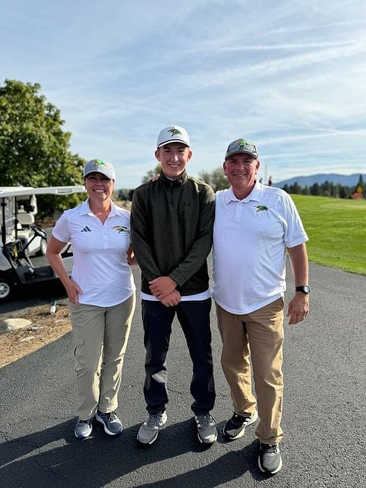 Courtesy photo
Lakeland High sophomore Tyler Zachary, center, shot a 3-under-par 70 to win 5A Region 1 medalist honors Thursday at The Links Golf Club in Post Falls. At left is Lakeland girls coach Colleen Hall, and at right is Hawks boys coach Brian Williams.