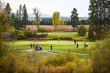 Glacier's Sam Engellant sinks a putt on the sixteenth green during the second round of the Class AA State Golf Tournament at Northern Pines Golf Club in Kalispell on Friday, Oct. 4. (Casey Kreider/Daily Inter Lake)