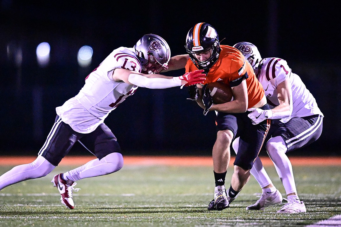 Flathead wide receiver Jack Blodgett (80) fights for extra yardage after a reception in the first quarter against Helena at Legends Stadium on Friday, Oct. 4. (Casey Kreider/Daily Inter Lake)