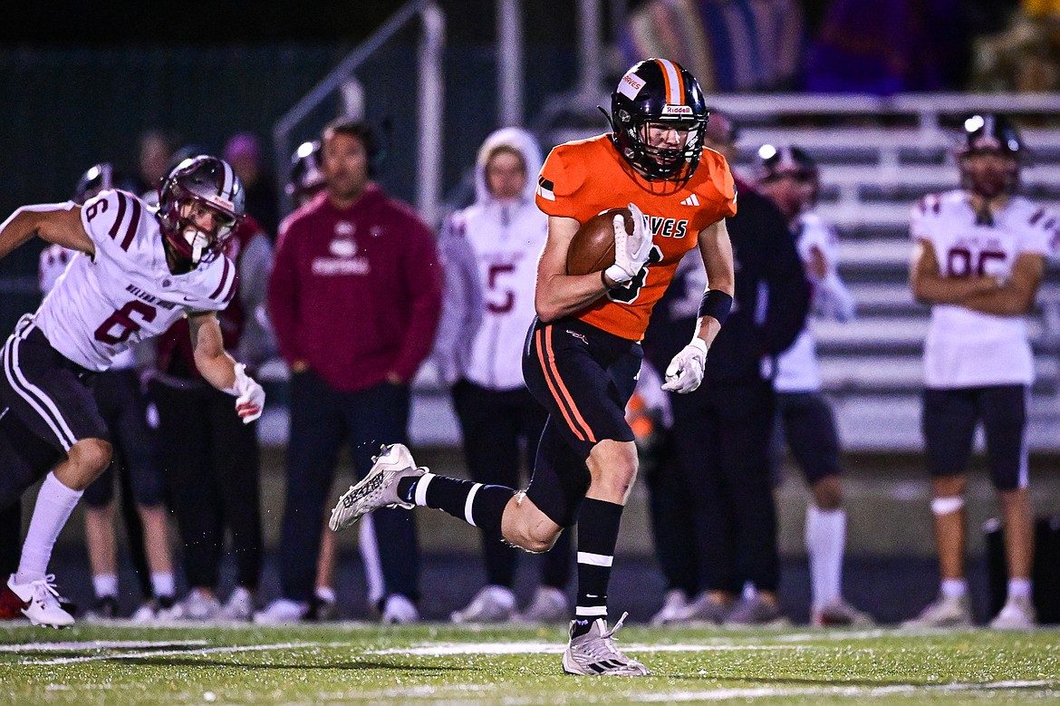 Flathead wide receiver Noah Sonju (8) heads down the sideline on a 93-yard touchdown reception in the second quarter against Helena at Legends Stadium on Friday, Oct. 4. (Casey Kreider/Daily Inter Lake)