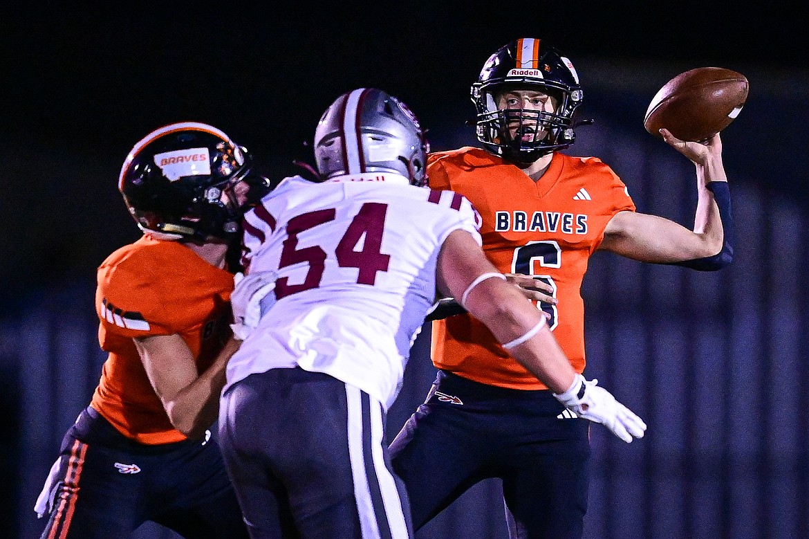 Flathead quarterback Eli Coopman (6) rolls out to pass in the first quarter against Helena at Legends Stadium on Friday, Oct. 4. (Casey Kreider/Daily Inter Lake)