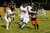 PREP FOOTBALL: Trojans turn up tempo, rout Battle Ground