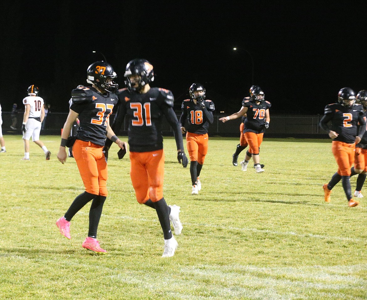 JASON ELLIOTT/Press
Post Falls freshman Bradyn Singleton (37) celebrates with junior teammate Alexander Dean (31) after Singleton's 28-yard field goal in the fourth quarter of Friday's 45-6 win over Battle Ground at Trojan Stadium.