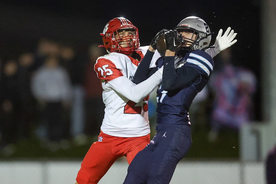 JASON DUCHOW PHOTOGRAPHY
Braden Meredith, right, of Lake City intercepts a pass intended for Maverick Gomez of Sandpoint on Friday night at Van Troxel Field.