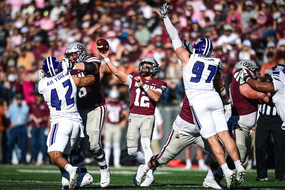 Grizzlies quarterback Logan Fife completes a 26-yard pass to wide receiver Keelan White in the fourth quarter against Weber State at Washington-Grizzly Stadium on Saturday, Oct. 5. (Casey Kreider/Daily Inter Lake)