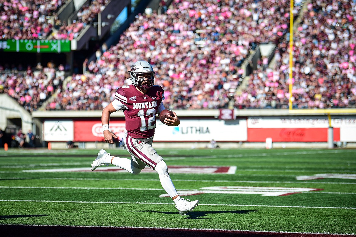 Grizzlies quarterback Logan Fife (12) scores a touchdown on a 2-yard run in the second quarter against Weber State at Washington-Grizzly Stadium on Saturday, Oct. 5. (Casey Kreider/Daily Inter Lake)