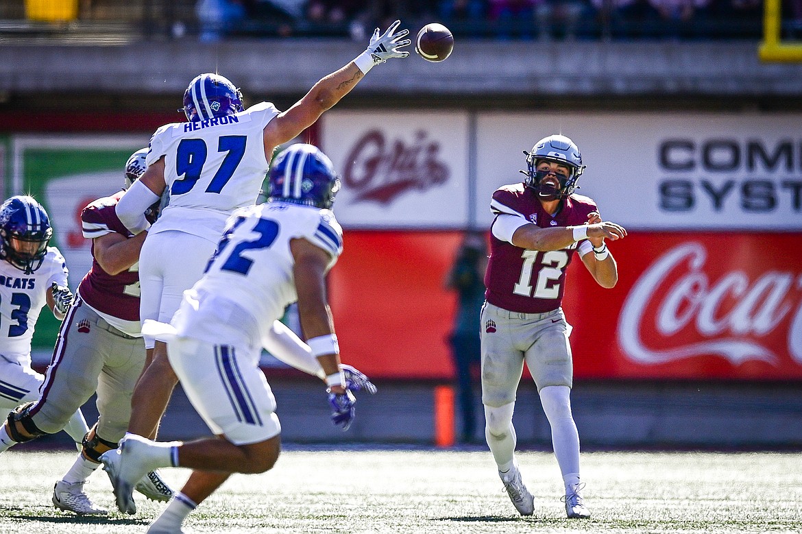 Grizzlies quarterback Logan FIfe (12) throws in the first quarter against Weber State at Washington-Grizzly Stadium on Saturday, Oct. 5. (Casey Kreider/Daily Inter Lake)