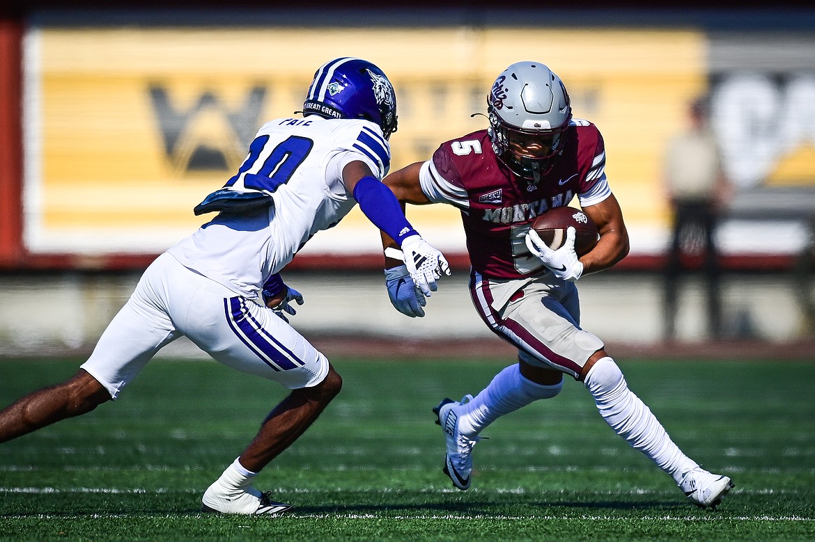 Grizzlies wide receiver Junior Bergen (5) picks up yardage on a reception in the second quarter against Weber State at Washington-Grizzly Stadium on Saturday, Oct. 5. (Casey Kreider/Daily Inter Lake)