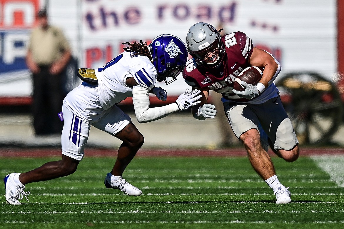 Grizzlies running back Nick Ostmo (26) picks up yardage after a reception in the second quarter against Weber State at Washington-Grizzly Stadium on Saturday, Oct. 5. (Casey Kreider/Daily Inter Lake)