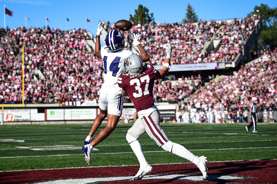 Montana cornerback Trevin Gradney (37) defends a pass attempt to Weber State wide receiver Jacob Sharp (14) in overtime at Washington-Grizzly Stadium on Saturday, Oct. 5. (Casey Kreider/Daily Inter Lake)