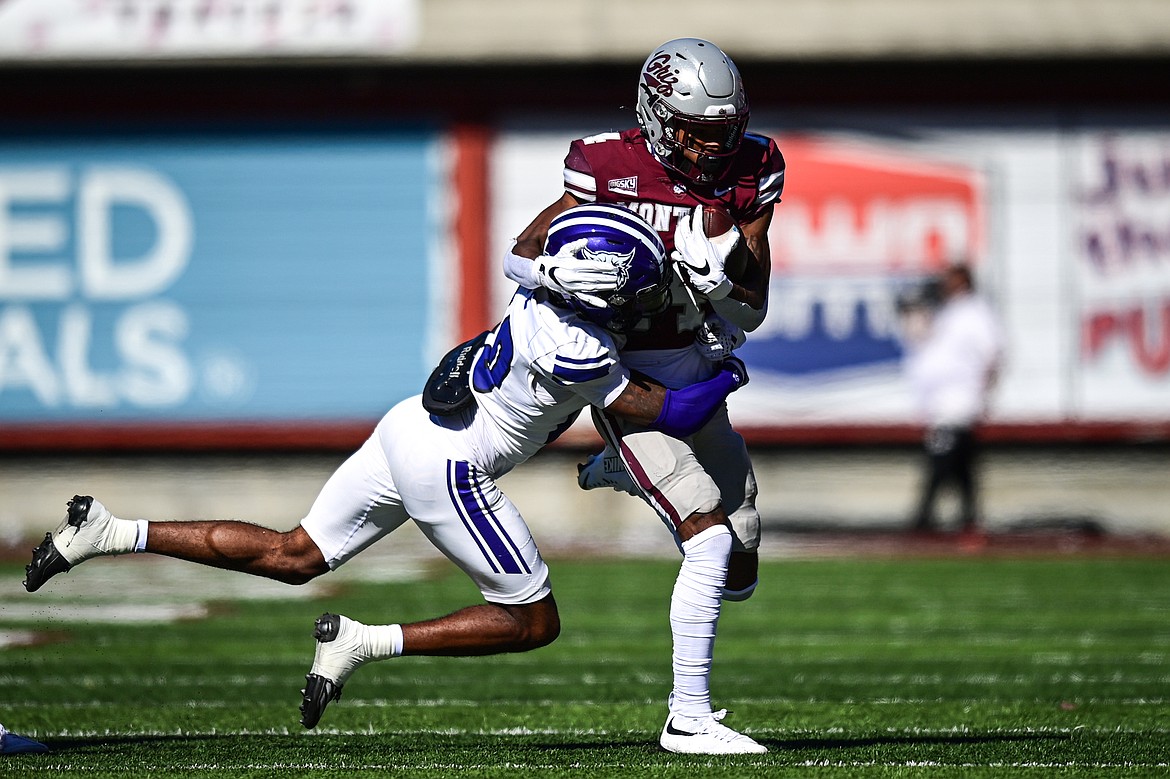 Grizzlies wide receiver Aaron Fontes (14) fights for yardage after a reception in the second quarter against Weber State at Washington-Grizzly Stadium on Saturday, Oct. 5. (Casey Kreider/Daily Inter Lake)