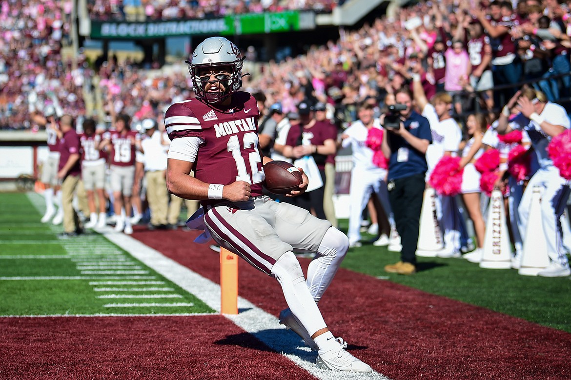 Grizzlies quarterback Logan Fife (12) scores a touchdown on a 2-yard run in the second quarter against Weber State at Washington-Grizzly Stadium on Saturday, Oct. 5. (Casey Kreider/Daily Inter Lake)