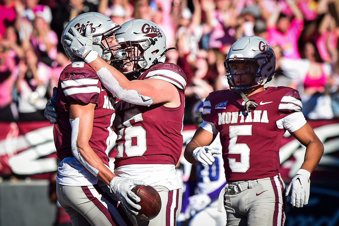 Grizzlies wide receiver Keelan White (6) celebrates with running back Nick Ostmo (26) and wide receiver Junior Bergen (5) after catching a 13-yard touchdown reception in the fourth quarter against Weber State at Washington-Grizzly Stadium on Saturday, Oct. 5. (Casey Kreider/Daily Inter Lake)