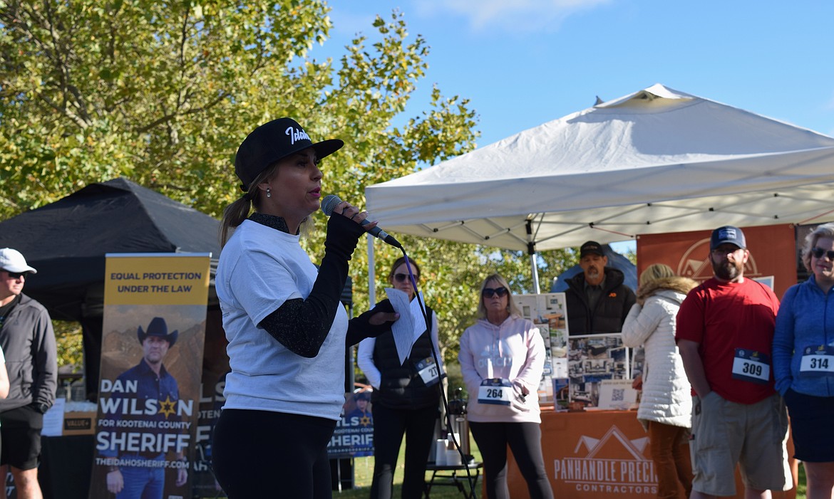 Safe Harbor founder and president Angie Sedore speaks to the runners ahead of Saturday's Freedom 5K run.