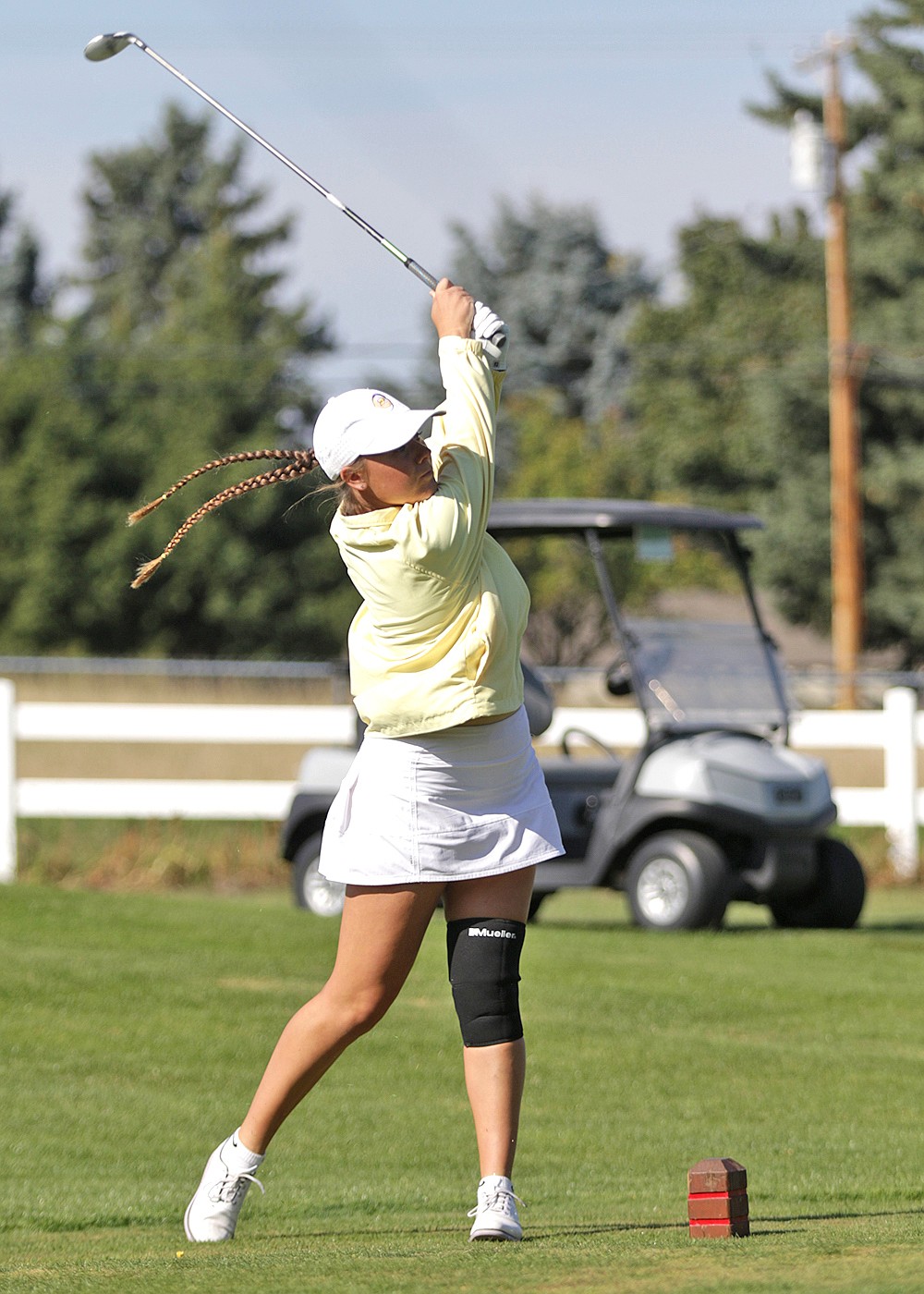 Polson's Kila Cannon drives the ball on hole two during last week's State A Golf Tournament. (Bob Gunderson photo)