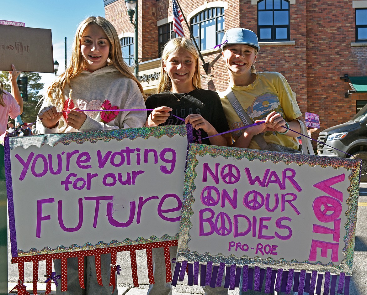 Whitefish middle schoolers Adelle Flynn, Kiya Rose Stein, and Piper Marberger at the women's rights rally on Sunday, Oct. 6. (Kelsey Evans/Whitefish Pilot)