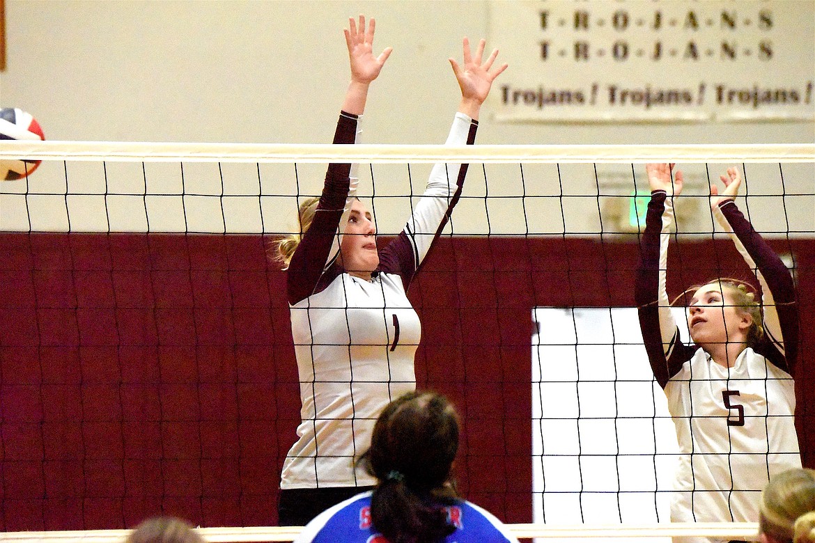 Troy's Autumn Fisher (1) and Addyson Fisher (5) battle at the net against Superior Saturday, Oct. 5, 2024. (Scott Shindledecker/The Western News)