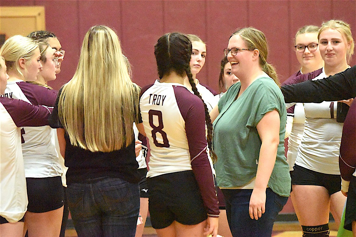 Troy volleyball coach Jordan Graves shares a moment with her team after Superior called timeout during the first set Saturday, Oct. 5, 2024. (Scott Shindledecker/The Western News)