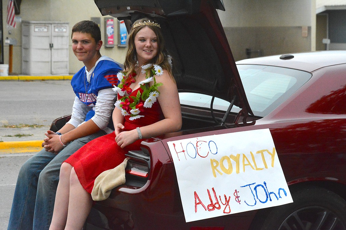 Riding in the trunk of a Dodge Challenger aint so bad when you're the Freshmen royalty for Superior High School, John Hughes and Addisyn Taggart. (Mineral Independent/Amy Quinlivan)