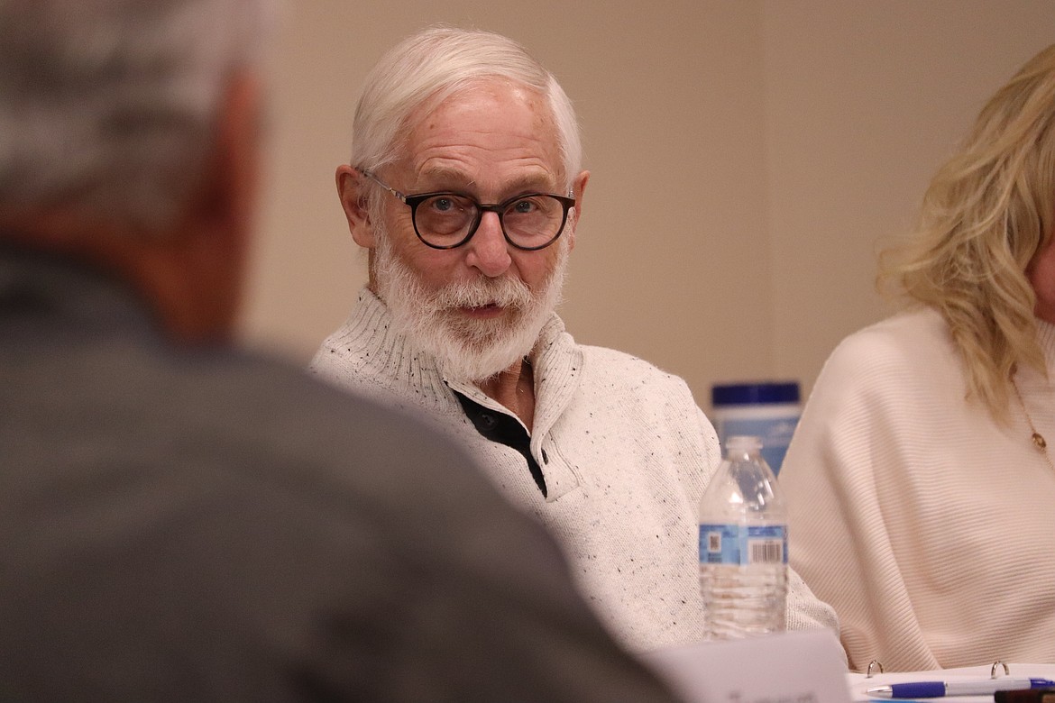 Coeur d'Alene City Councilman Dan English listens to council applicant John Austin's response to a question Monday at City Hall.